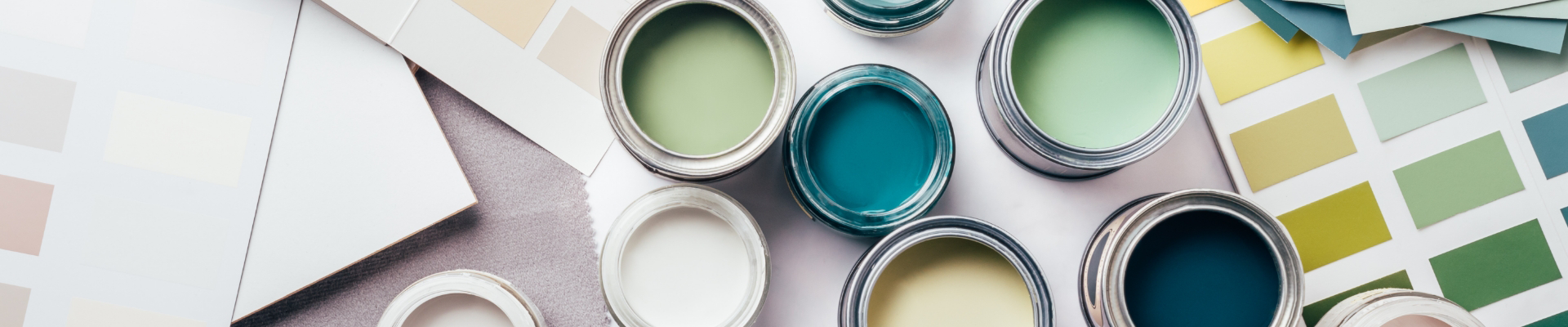 Green, blue, and yellow paint swatches and paint samples