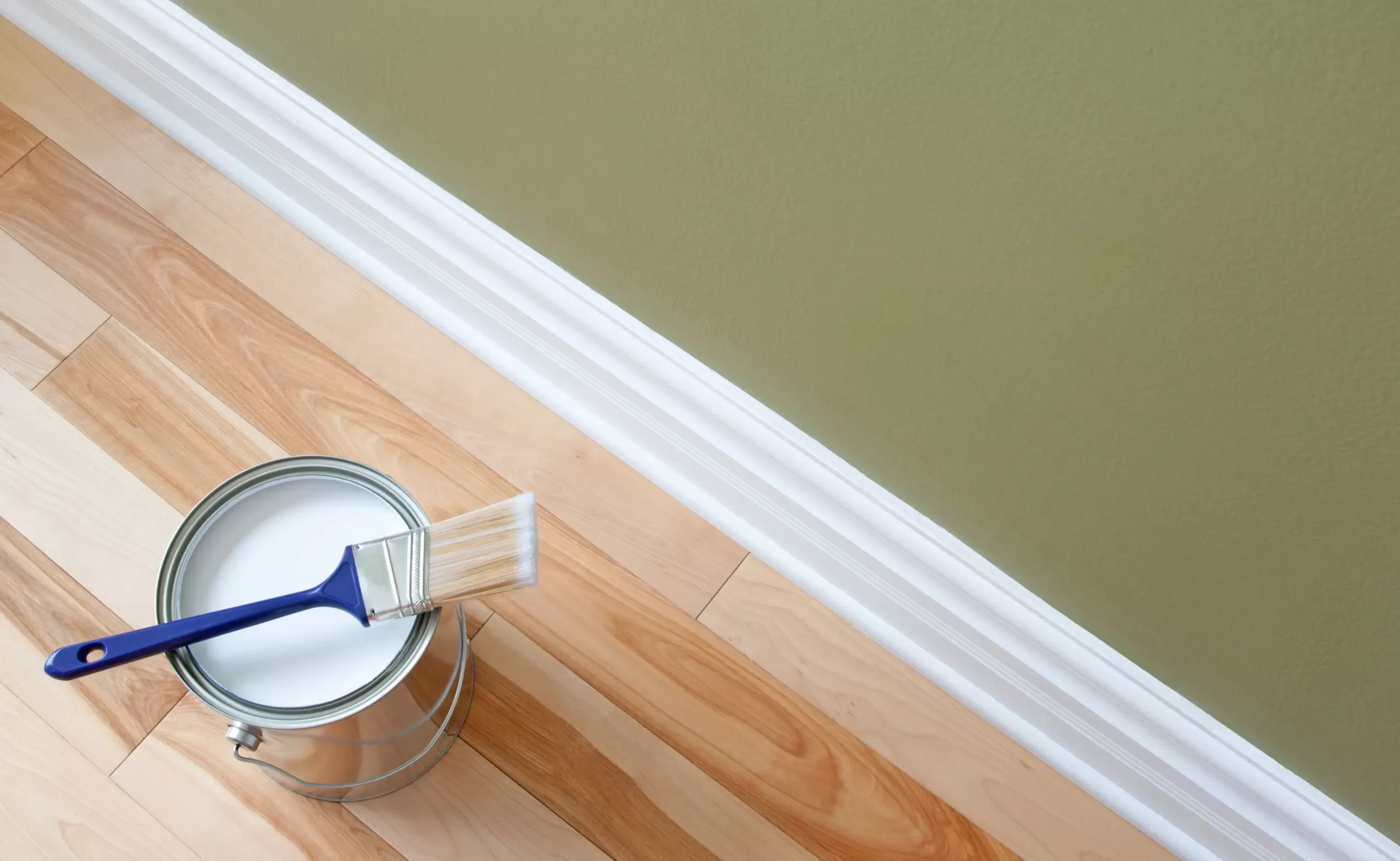 white painted trim with a green painted green and light wooden floor